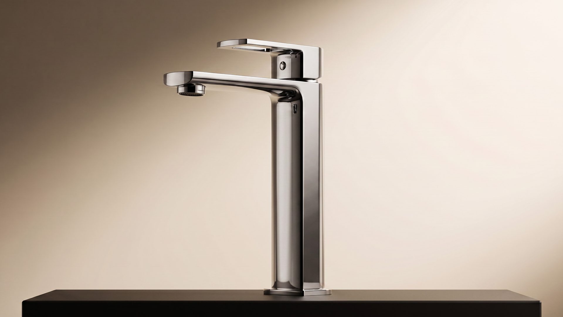 Tall Lavish vessel mixer on a black stone counter