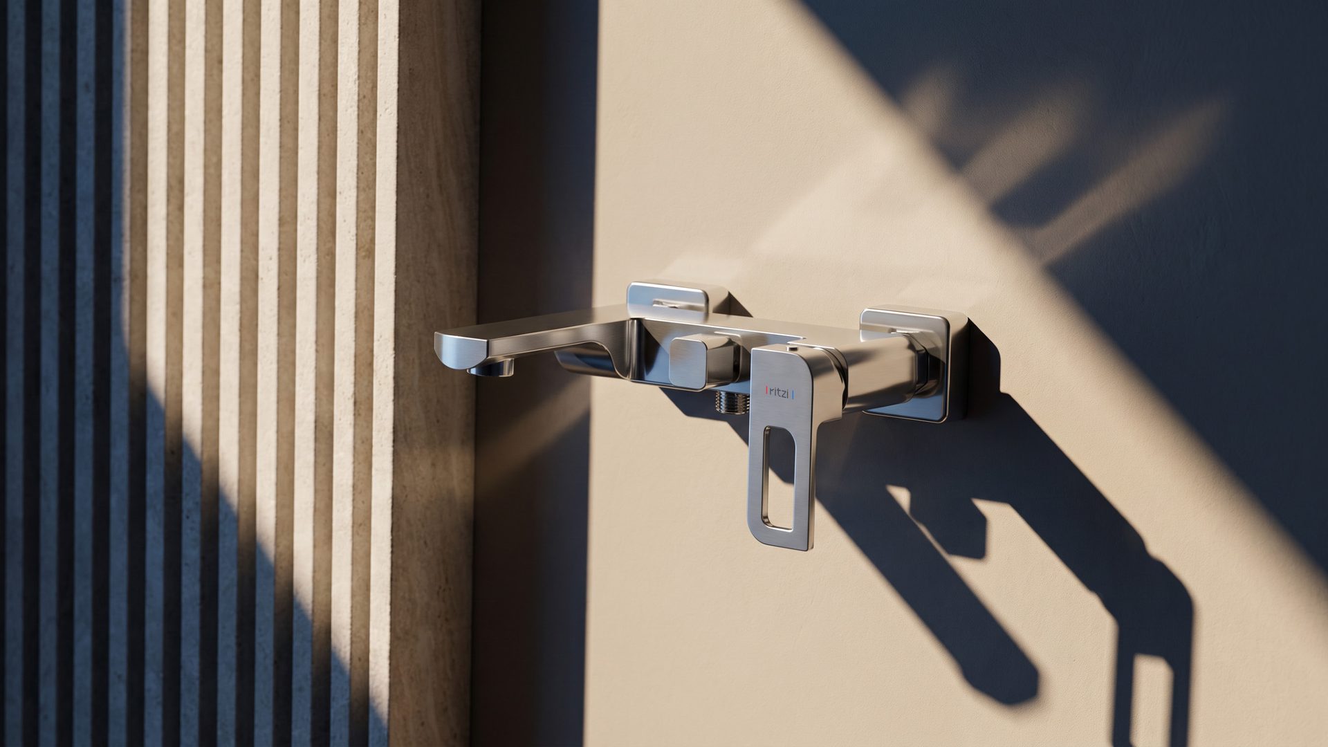 Wall-mounted Lavish mixer casting long shadows across a ribbed blue wall