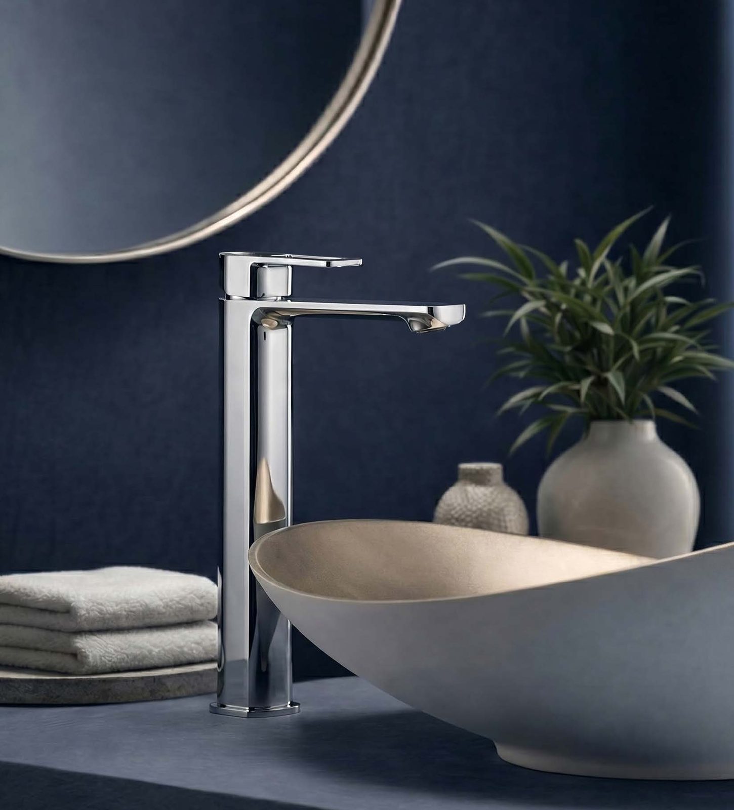 Lavish Single lever High basin mixer on a navy vanity with a round mirror
